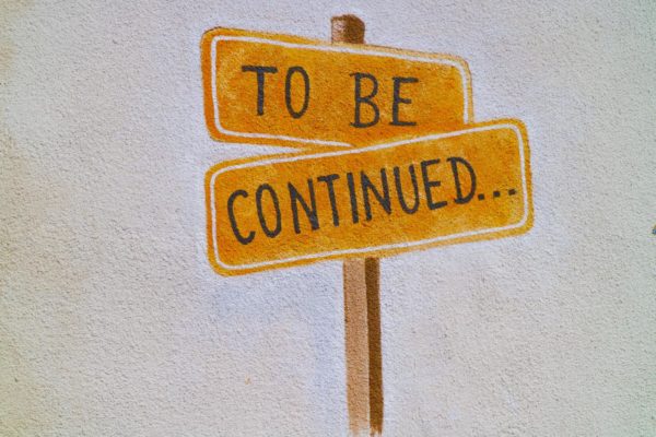 Image of a sign post with the text that reads "To be continued", reflecting the tension element of storytelling.