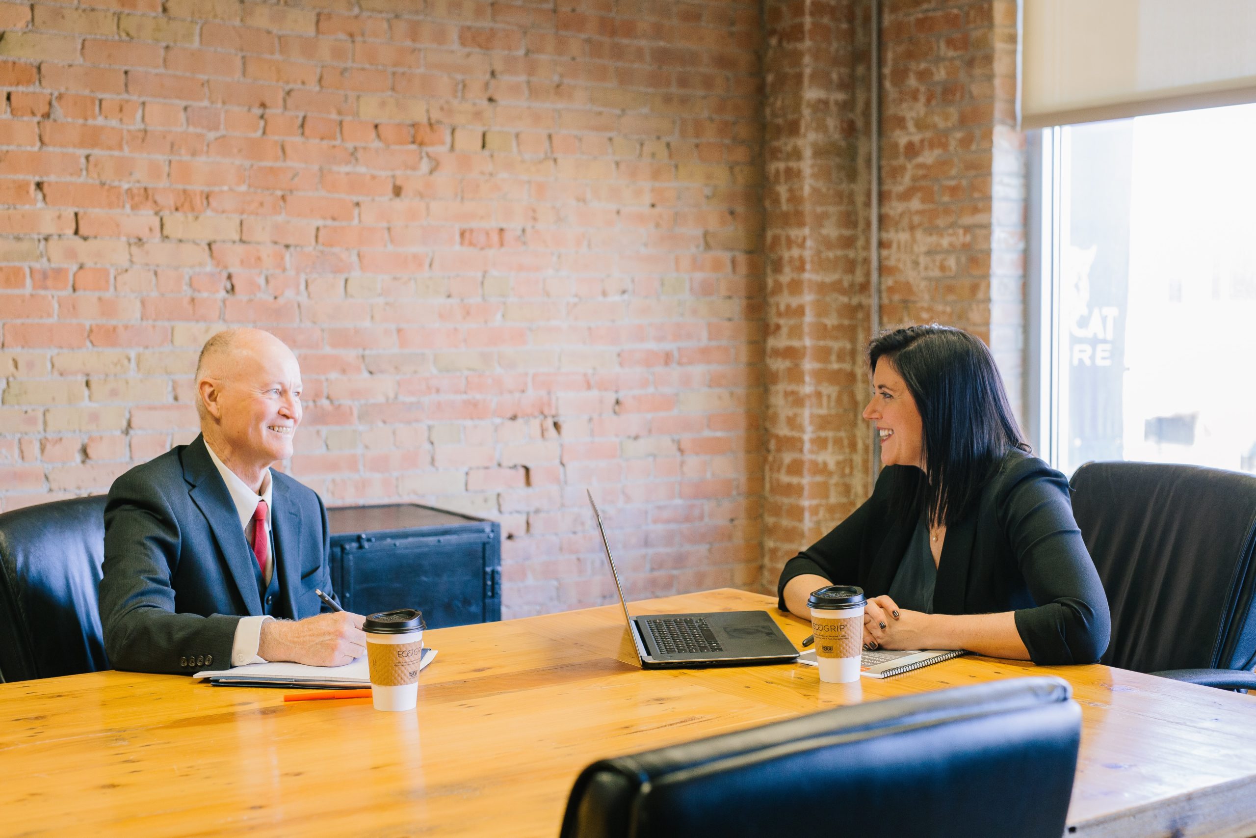 A man interviewing for a senior position and asking questions in the interview.