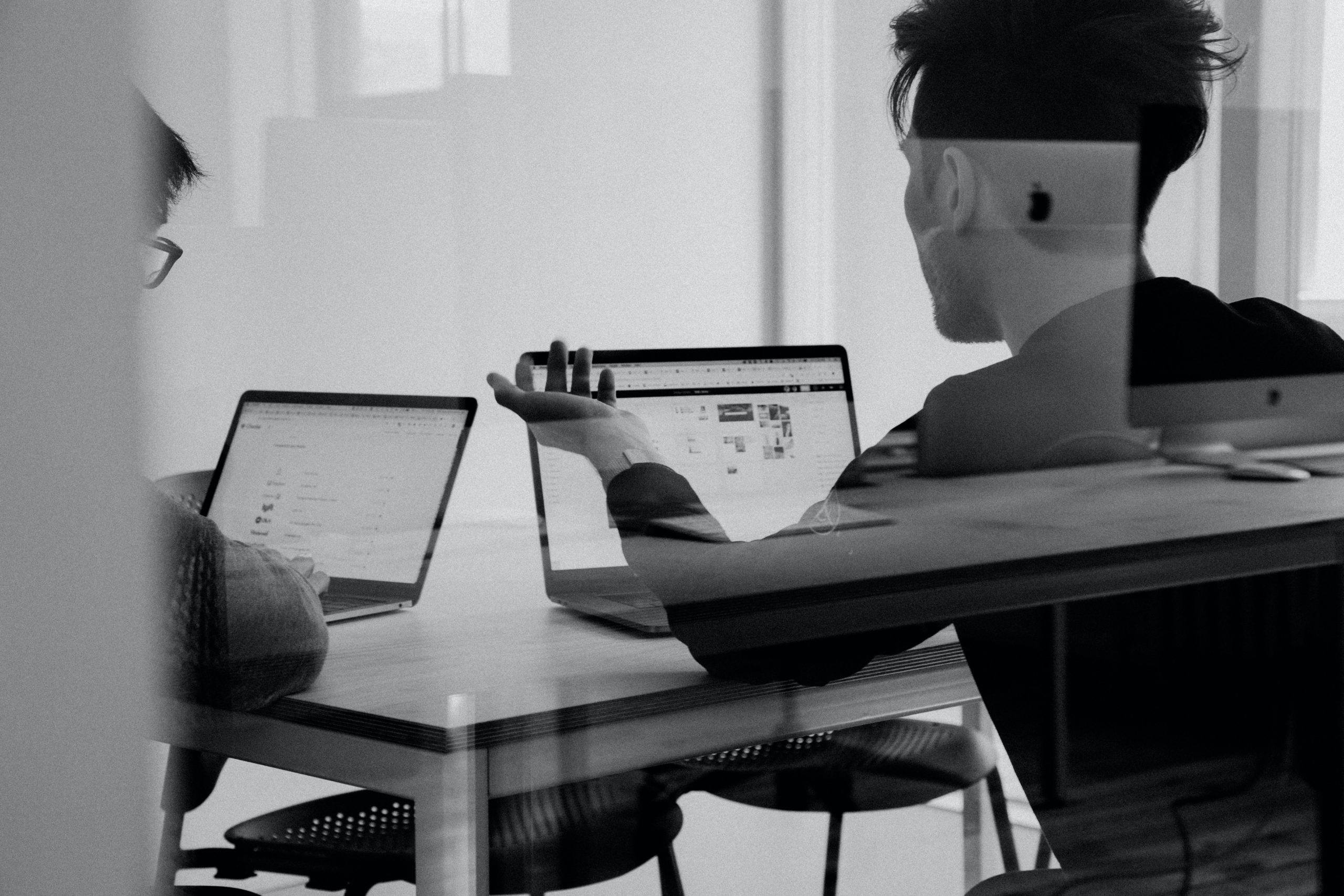 People meeting and mentoring each other. Image in black and white.