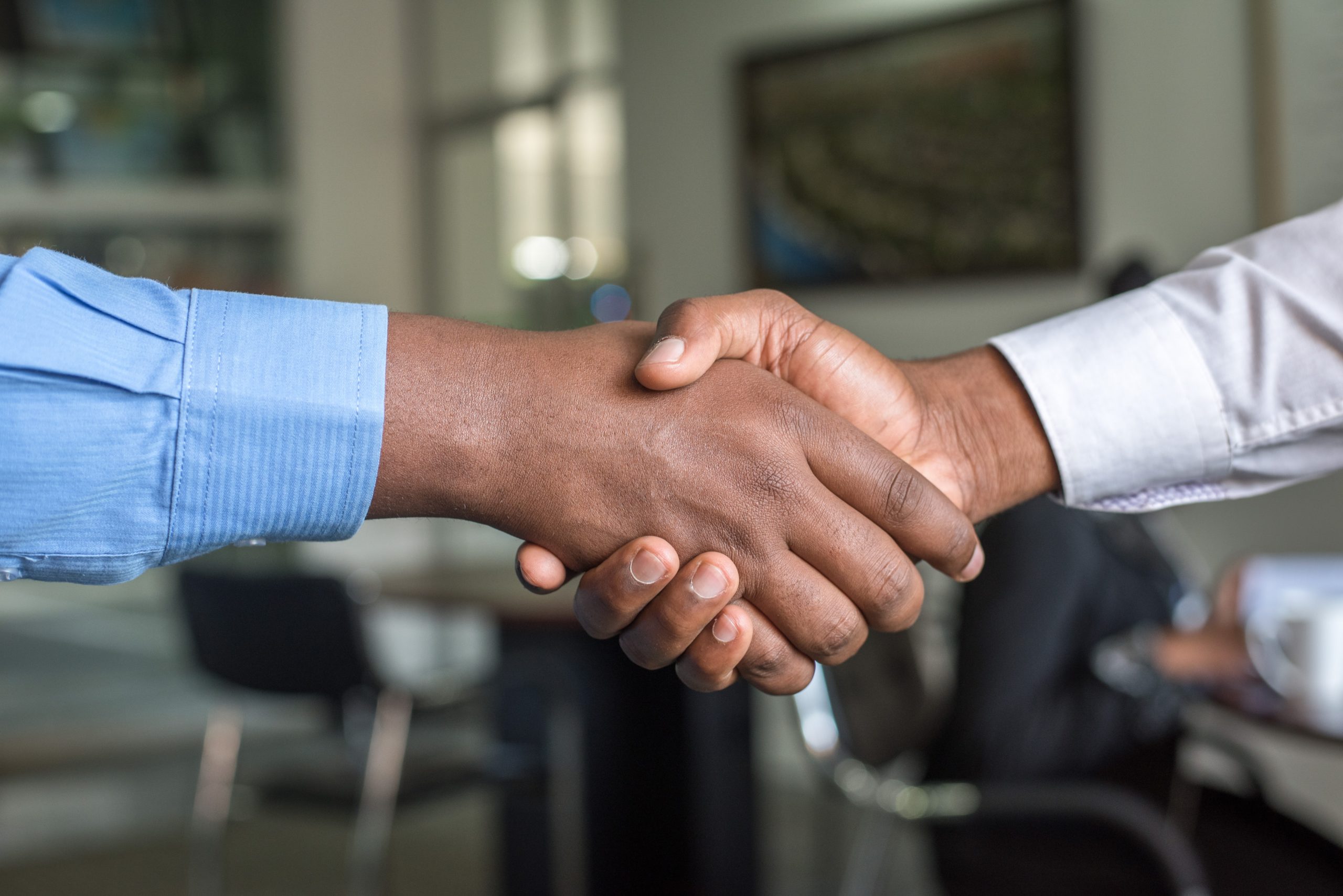 Hands holding each other after candidates having a successful job interview.