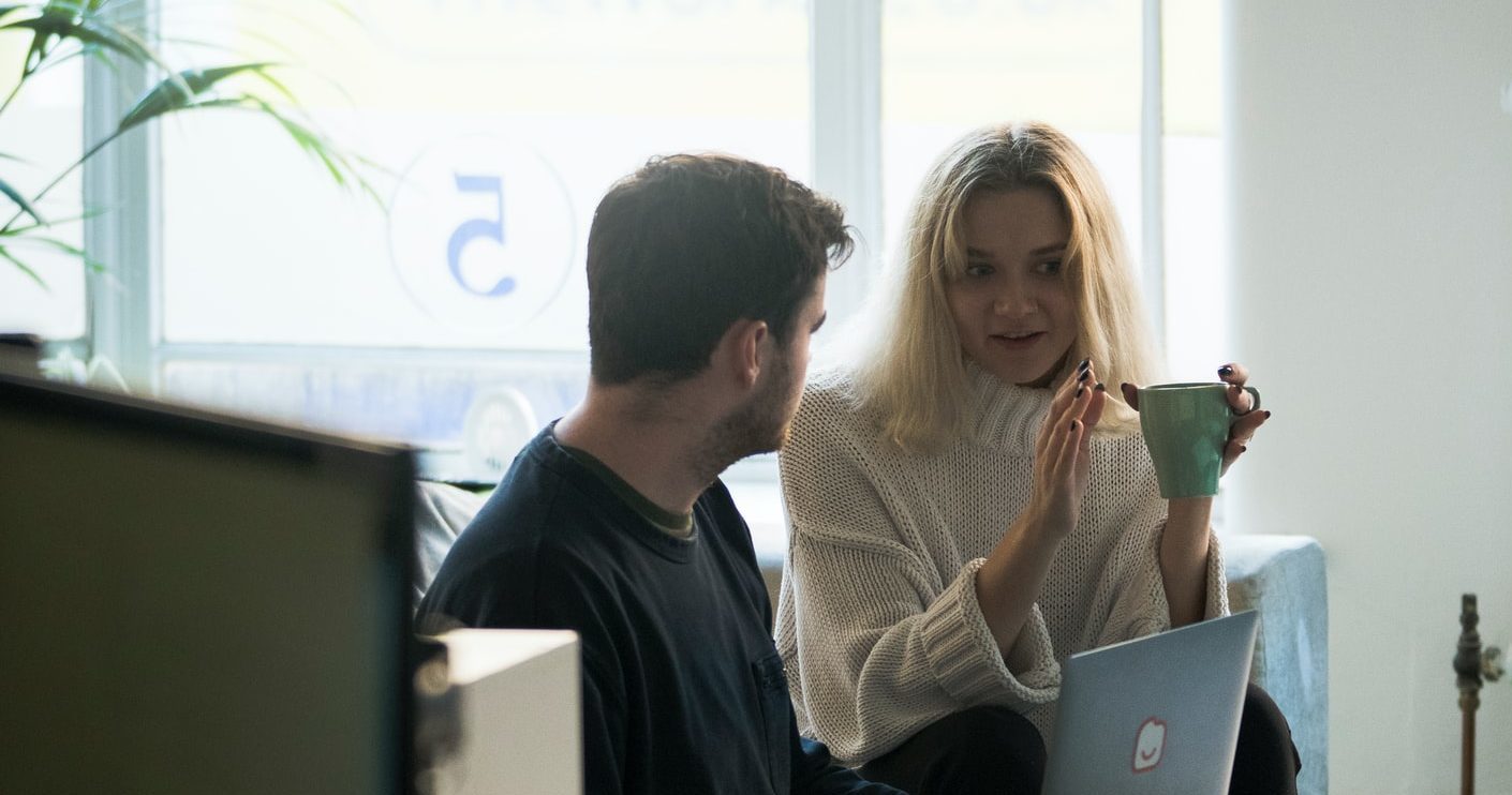 A woman sharing freelancing tips with a man.